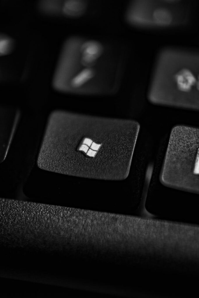 pexels photo 4567339 4567339 1 High-quality close-up of a Windows logo key on a black plastic keyboard.